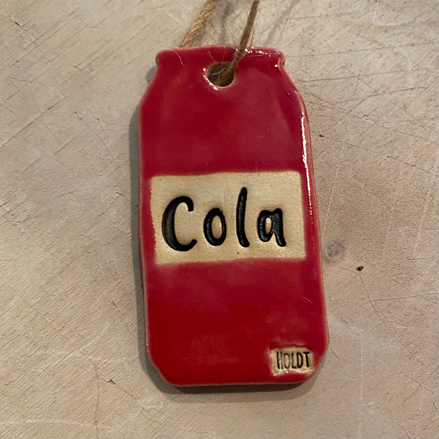 Ophæng, Cola