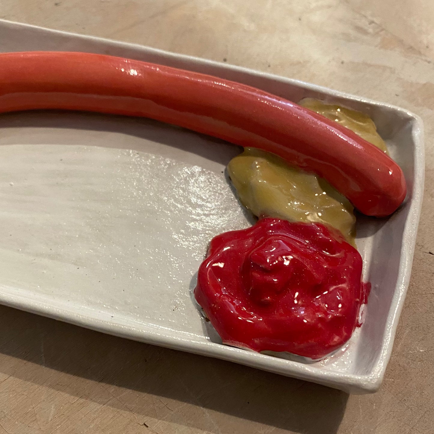 Unika håndformet pølsebakke