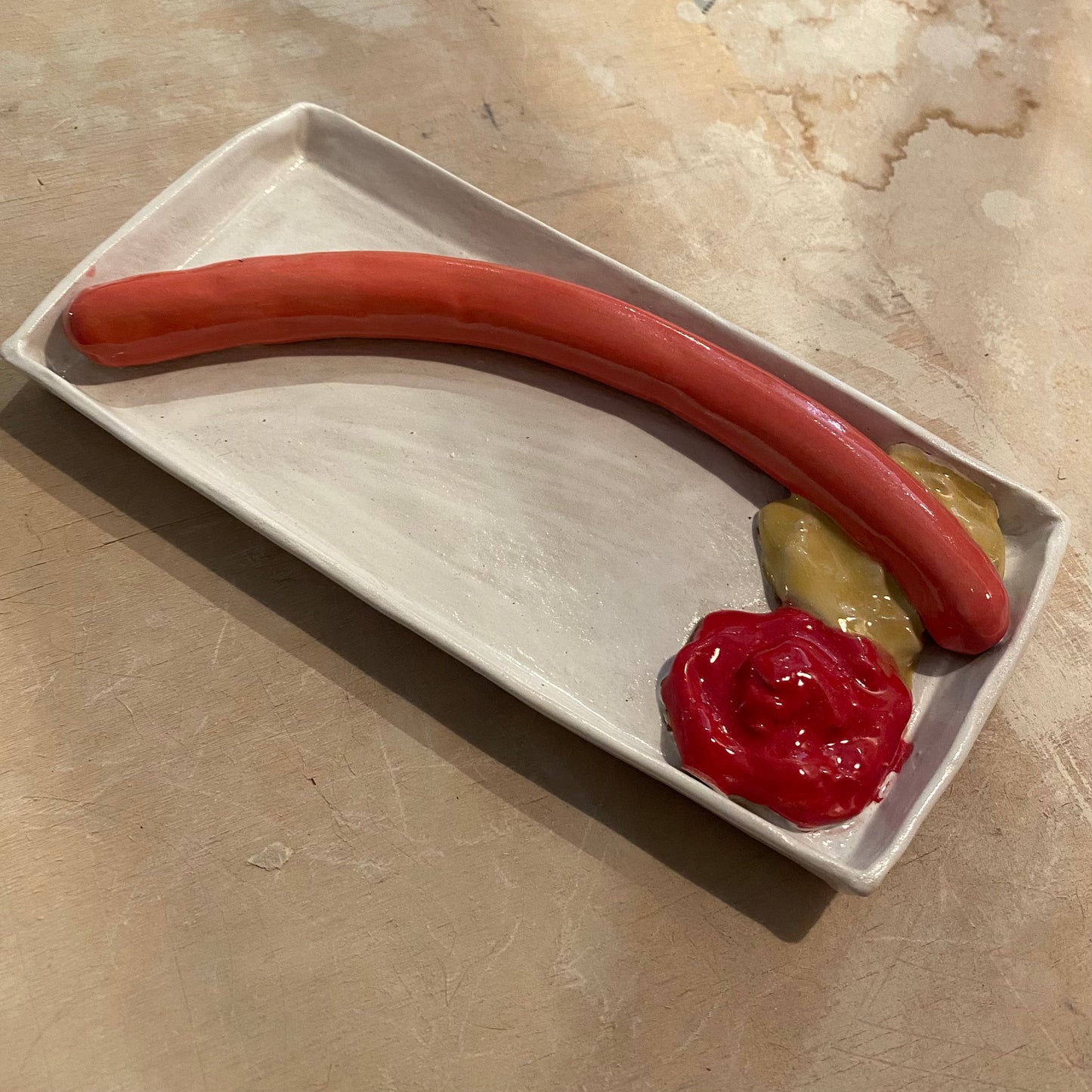 Unika håndformet pølsebakke